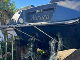a boat that is sitting on the ground in the yard