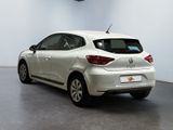 the rear end of a white car is parked in a room