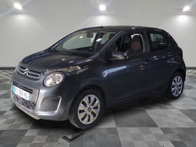 a picture of a small car parked in a garage
