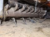 an image of a tractor with a chain attached to it ' s back