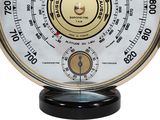 an image of a clock with a barometer in the middle of it