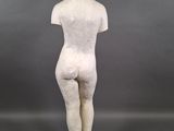 a white marble statue of a woman standing on a square base