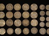 an image of a large collection of coins on a black background