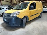 yellow van parked in a garage with other cars in the background