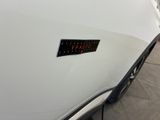 a sticker on the hood of a white car