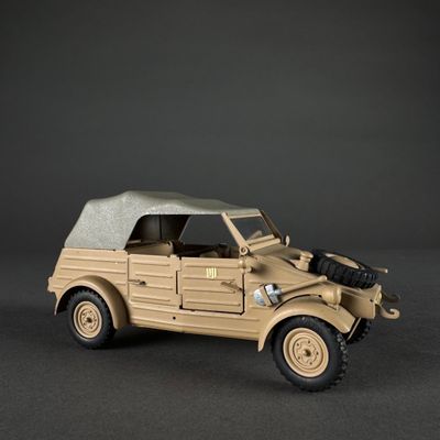a toy army vehicle with a gun on the back of it