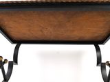 a wooden table with a metal frame and a wooden top