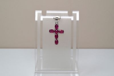 a red cross on a clear display case on a table