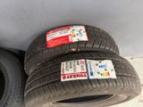 two tires are sitting next to each other on the ground