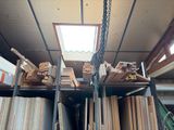 a large amount of wood on the shelves in the room