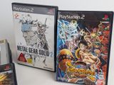 two video games are sitting next to each other on a table