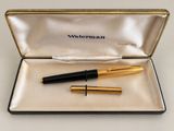 fountain pens in a case on a table with a white background