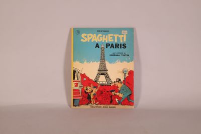 an old children ' s book with a picture of the eiffel tower in the background