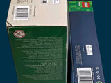 a box that is sitting next to a box that has a sticker on it