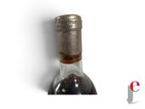 a bottle of wine that is sitting on a table