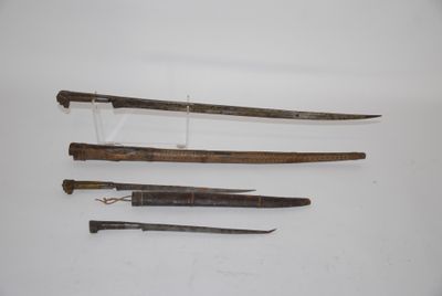 three different types of swords are displayed on a white surface