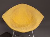 pair of yellow chairs with metal legs and a yellow seat