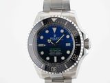 rolex submarine watch with blue dial and black bezel