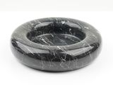 black marble ashtray with white speckles on a white background