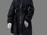 an image of a mannequin dressed in a black rain coat