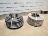 two hoses sitting next to each other on the floor