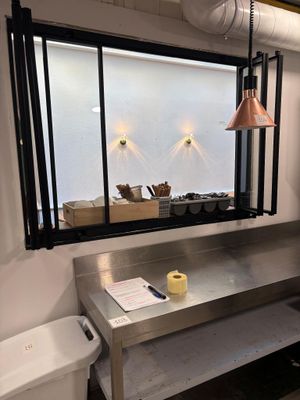 a picture of a kitchen with a sink and a window