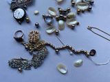 a lot of jewelry that is laying out on the table