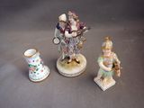 three figurines that are sitting next to each other