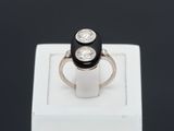 an image of a black and white diamond ring on a white box