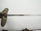 a sword that is hanging on the wall