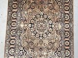 an antique persian rug with a medallion design and fringe fringes
