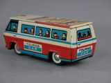 a toy bus with people on the side of it