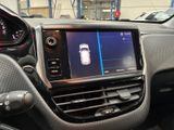 the interior of a car with a display of a cell phone in the center