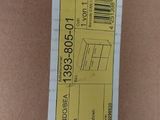 a cardboard box with a yellow label on it