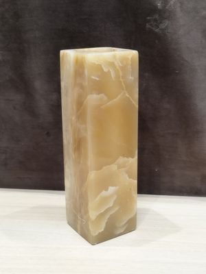 a picture of a candle that is sitting on a table