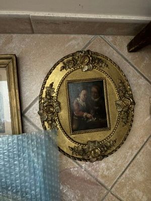 a picture of a picture of a man in a gold frame
