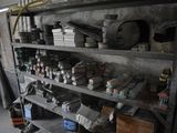 a shelf full of assorted items in a garage