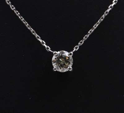 a diamond necklace on a mannequin necklace