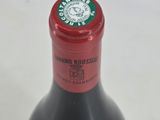 a bottle of wine that is sitting on a table