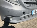 a close up of the front of a car with a number plate on it