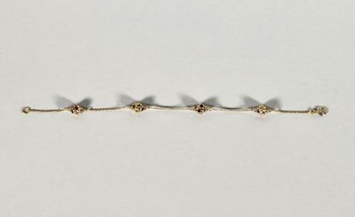 Bracelet en or jaune 18K (750°/°°) serti de pierres fines. (Fermoir ca