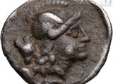a close up of a coin with a bird on it