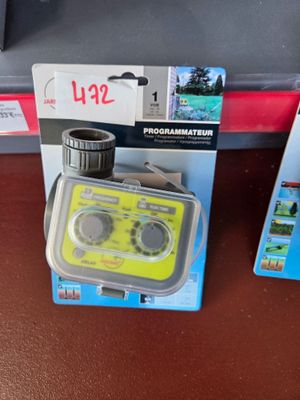 a yellow radio sitting on top of a table next to other items