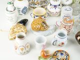 many different types of vases and bowls on the table