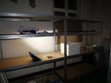 a shelf that has some items on it in a room