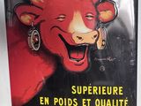 panneau métallique représentant une vache avec une cloche sur la tête