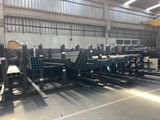 an image of a warehouse filled with lots of steel pipes