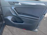 the door of a car with the driver ' s door open