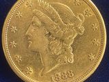 a close up of a gold coin on a blue surface