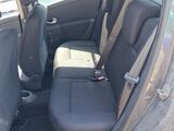 the back seats of a car with the door open in a parking lot